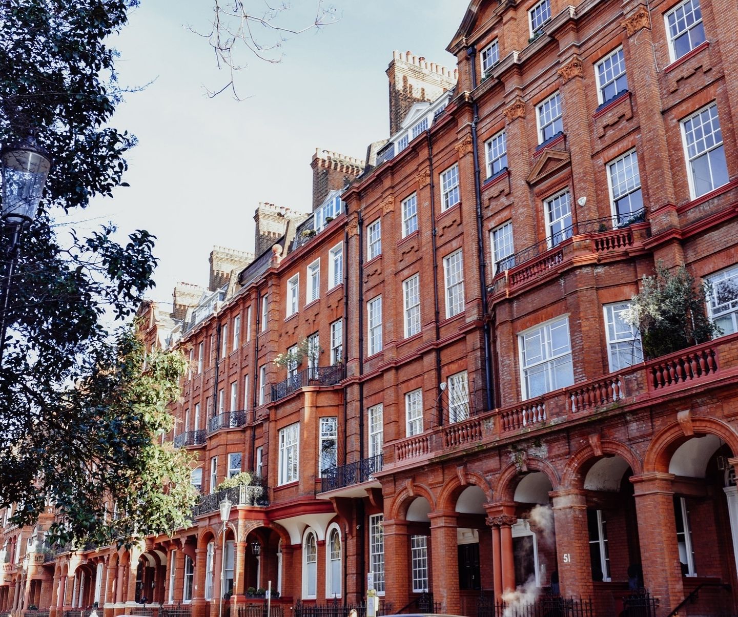A traditional red brick apartment building in London