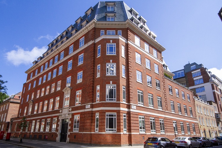 A large red brick apartment building in Westminster