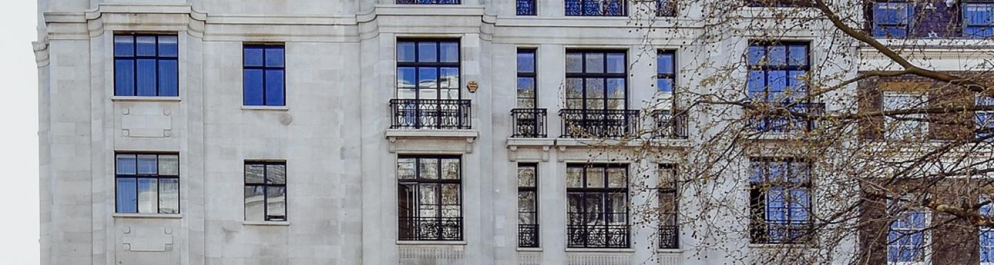 9 storey apartment block with grey/white walls 