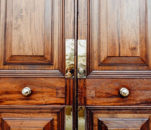 Old wooden door with brass fittings