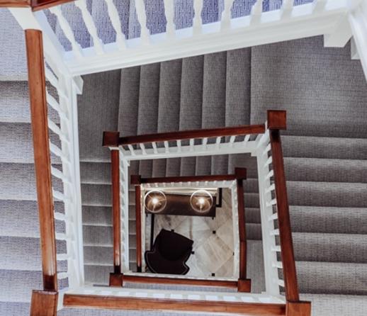 Internal staircase looking down from the top floor