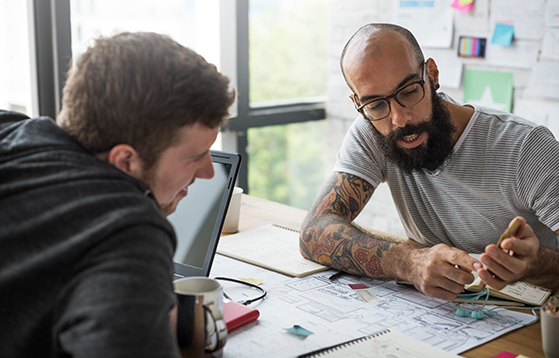 two people discussing a design
