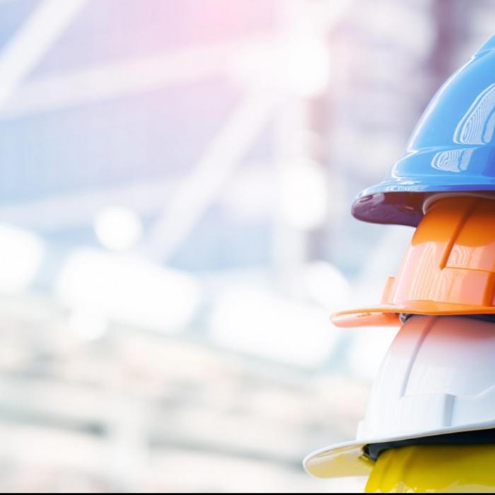 Pile of hard hats on a building site