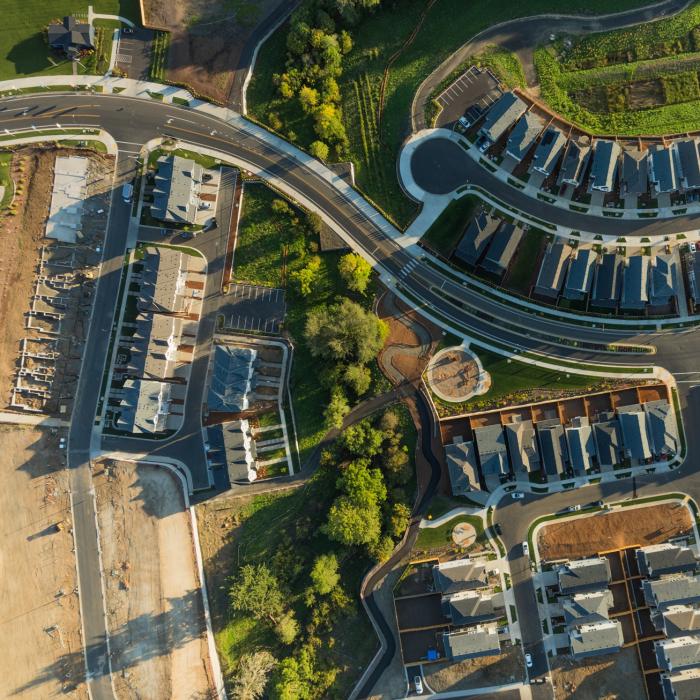 An aerial view of a new UK housing development with some units still under construction